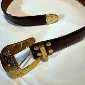 Al beres leather and 22kt plated gold belt.